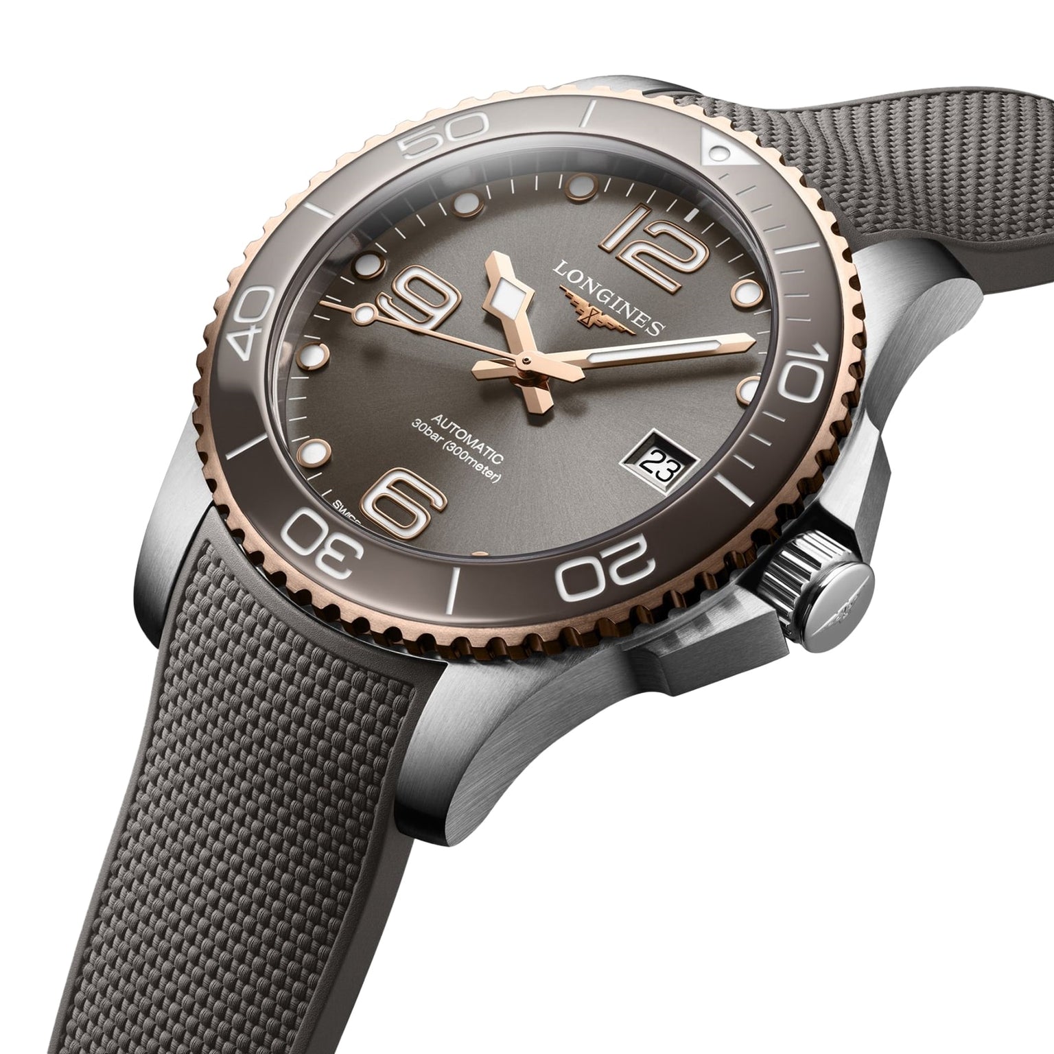 A close-up of the Longines HydroConquest, an automatic wristwatch with grey textured strap, bronze bezel, grey dial, Swiss Super-LumiNova markers, date at 3 o’clock, and water-resistant craftsmanship.
