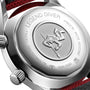 Close-up of the Longines Legend Diver’s case back displays engraved text and a diving figure emblem, featuring a stainless steel finish and a red-black strap detail.