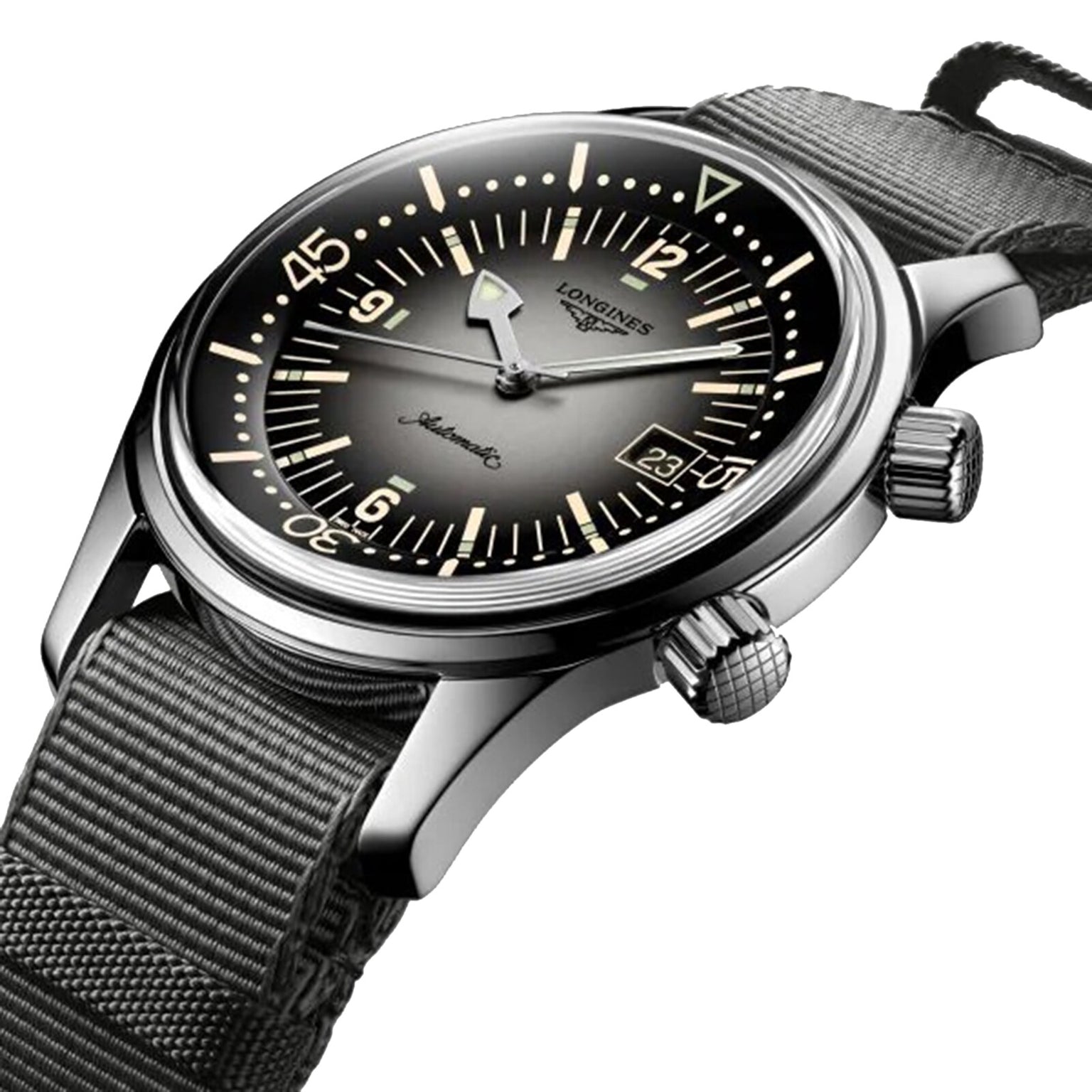 A close-up of the Longines Legend Diver watch, showcasing its L888 calibre movement, black dial with luminous markers, dual crowns, and a green fabric strap.