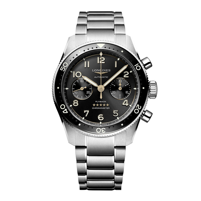 The Longines Spirit Flyback is a stainless steel chronograph wristwatch with a black dial, three subdials, and a metal bracelet, reflecting the brand’s historic aviation heritage.