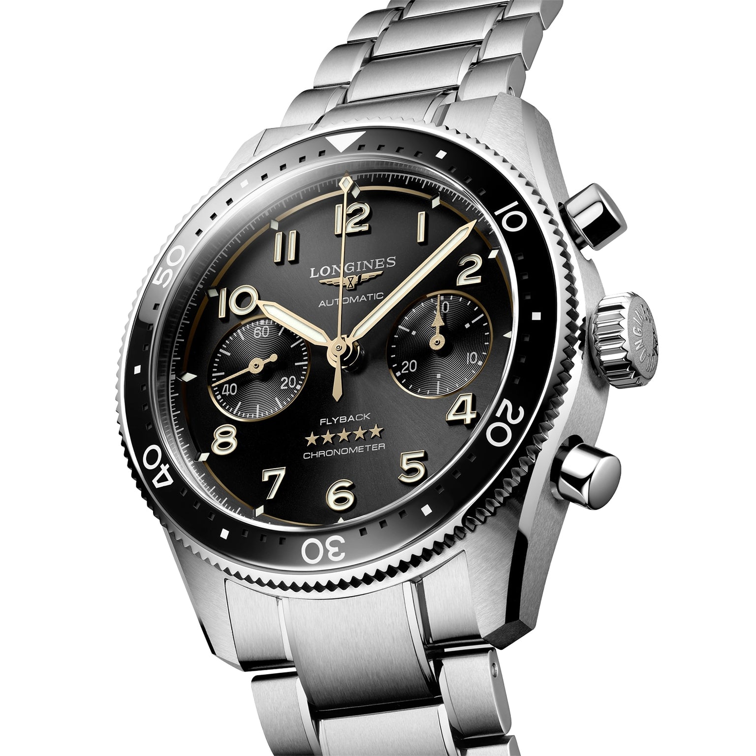 The Longines Spirit Flyback is a stainless steel chronograph wristwatch with a black dial, luminous Arabic numerals, three subdials, and a metal bracelet, inspired by the brands aviation heritage.