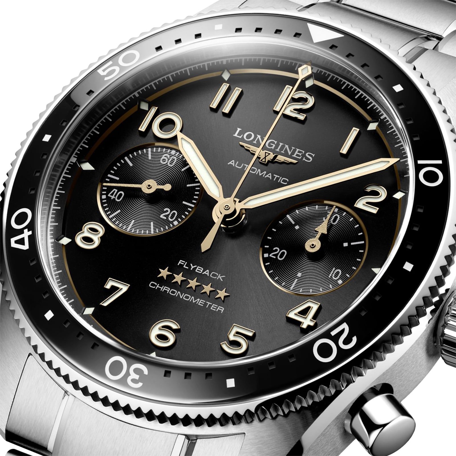 Close-up of the Longines Spirit Flyback automatic chronometer, inspired by aviation heritage, featuring a black dial with gold-tone hands, chronograph subdials, and a stainless steel bracelet.