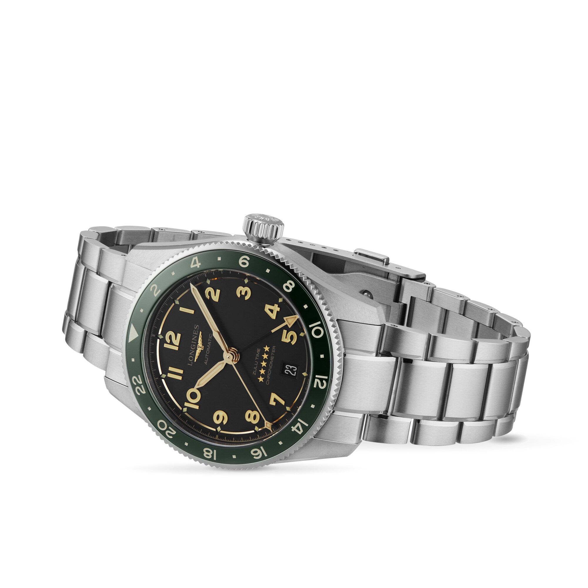 The Longines Spirit Zulu Time wristwatch features a stainless steel case, black dial with Arabic numerals, date window, green ceramic and black bezel, and metal link bracelet, displayed at an angle on a white background.
