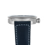 Side view of the Longines Spirit Zulu Time wristwatch, showcasing a stainless steel case, crown, black leather strap with white stitching, and a black bezel with white numerals for tracking multiple time zones.