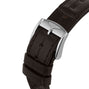 Close-up of a black leather strap with silver buckle, featuring an embossed winged logo—capturing the innovative spirit of the Longines Flagship Heritage Moonphase.