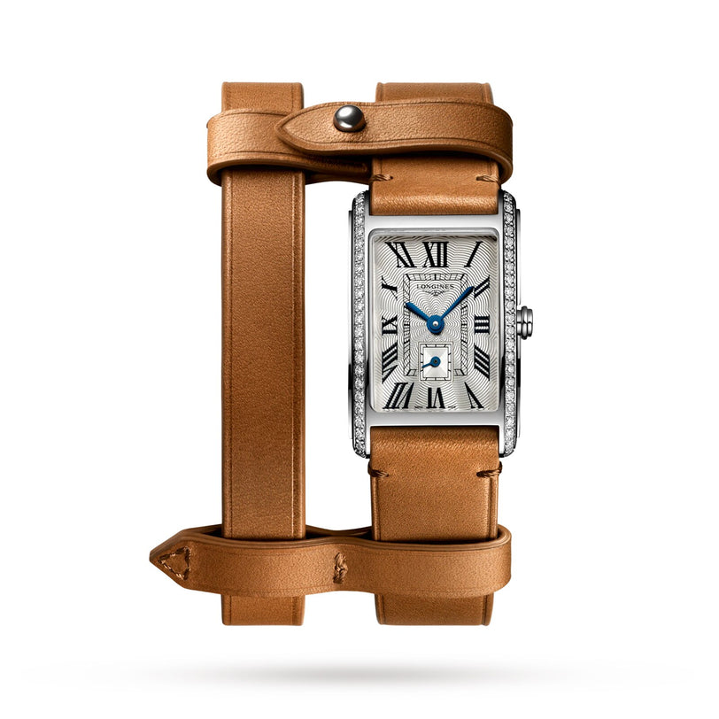 The Longines DolceVita X YVY rectangular watch features a diamond bezel, Roman numeral dial, blue hands, and a light brown double-wrap leather strap with an interchangeable system, shown on a white background.