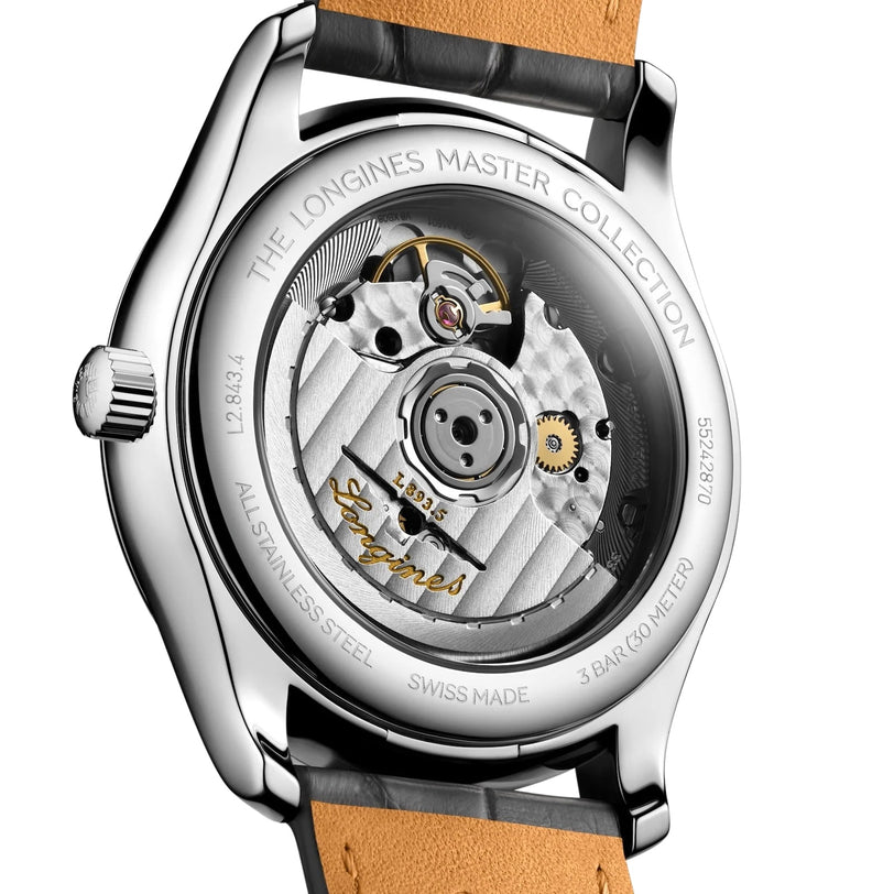 Close-up of the Longines Master Collections transparent case back, showcasing its self-winding movement and engraved details on the stainless steel rim.