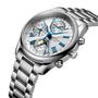 The Longines Master Collection Chrono Moonphase features a silver metal band, white dial with blue Roman numerals, multiple subdials, and an elegant moonphase display inspired by the collection’s automatic movement.