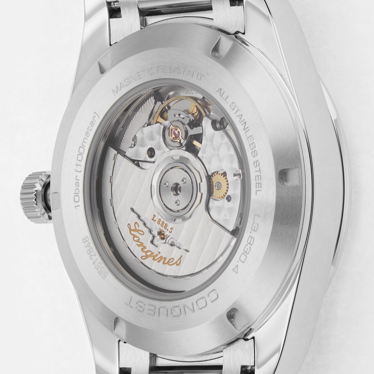 Close-up of the back of a Longines Conquest stainless steel watch, highlighting its automatic movement, engraved details, and transparent case back.