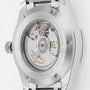 Close-up of the back of a Longines Conquest stainless steel watch, highlighting its automatic movement, engraved details, and transparent case back.