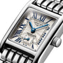 Close-up of the Longines Mini DolceVita wristwatch featuring a silver metal bracelet, blue hands, blue Roman numerals, and a date subdial on a textured white dial—a modern icon of luxury from Longines.