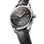 The Longines Conquest Heritage Central Power Reserve features a silver and black design, dark leather strap, gold hour markers with Swiss SuperLumiNova®, and a date display at 12 oclock.