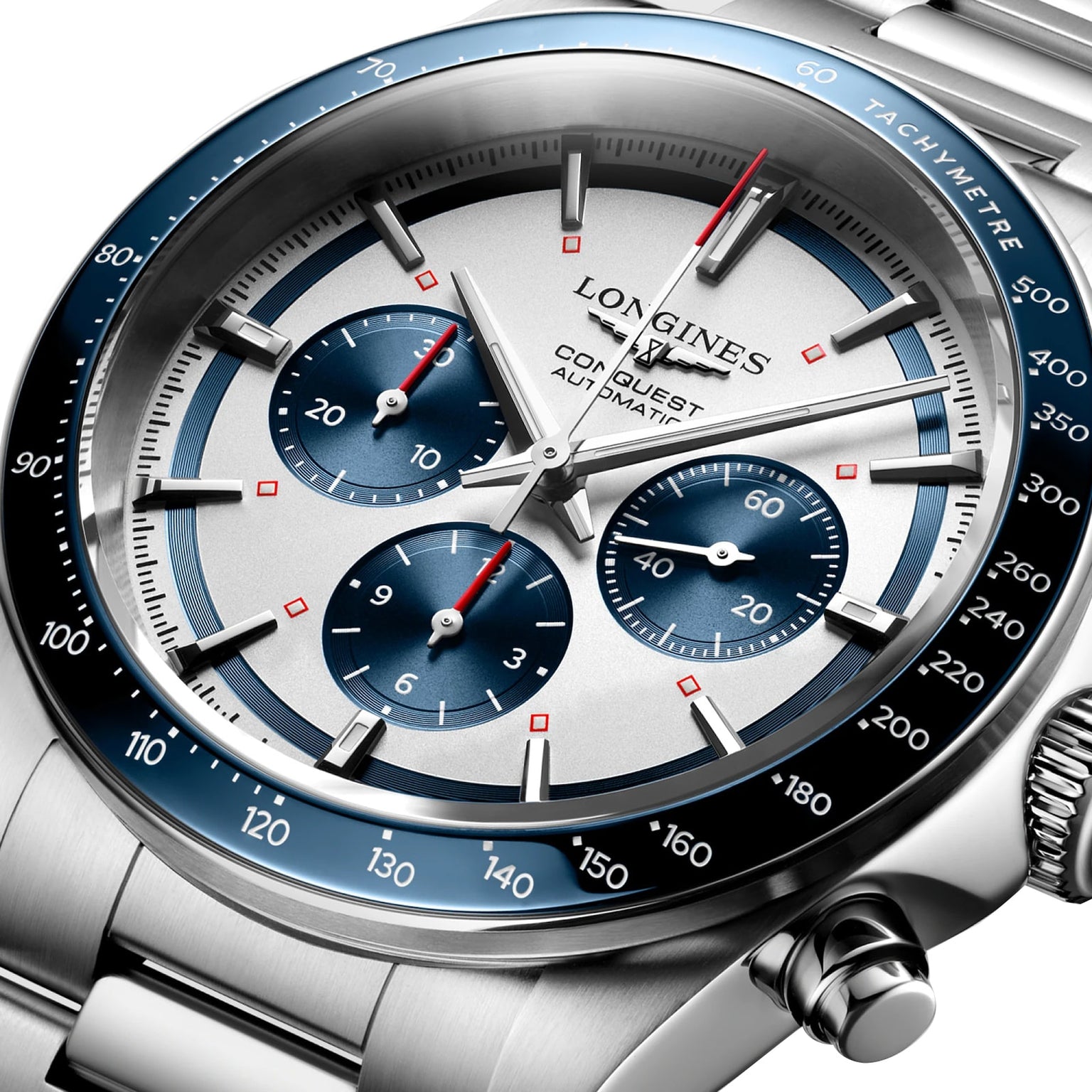 Close-up of the Longines Conquest Chronograph featuring a silver dial, blue bezel with tachymeter, three blue subdials, and a stainless steel bracelet with self-winding movement.