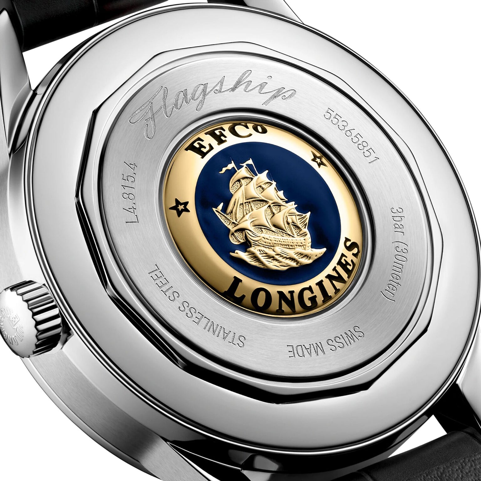 Close-up of the Longines Flagship Heritage Moonphase watch back, highlighting a gold and blue ship medallion and engraved details that reflect the brand’s commitment to precision and elegance.