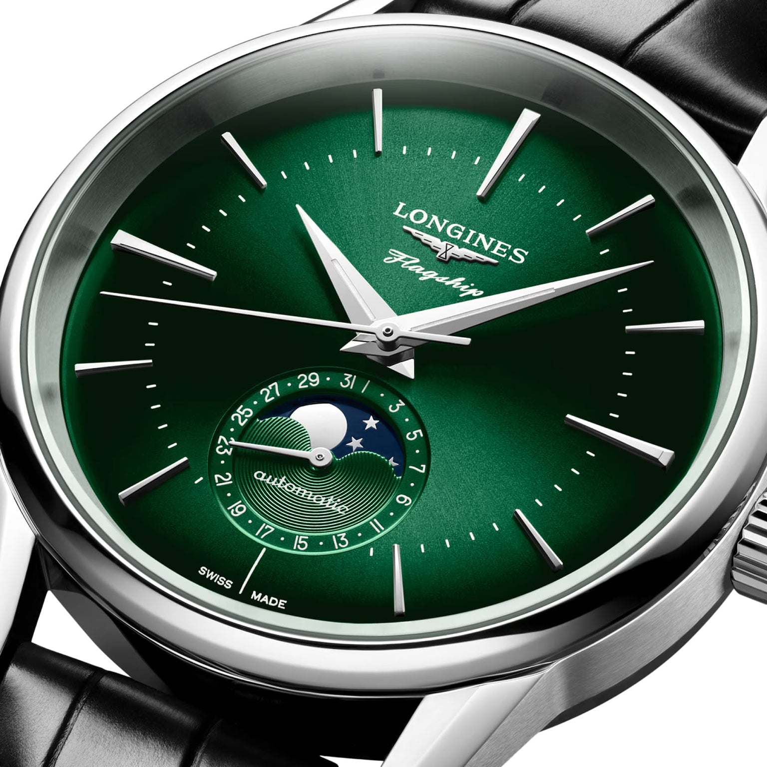 The Longines Flagship Heritage Moonphase is a green wristwatch featuring silver markers, a moonphase subdial, and a black leather strap.