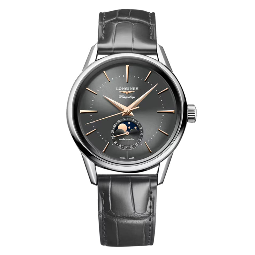 The Longines Flagship Heritage Moonphase boasts a grey dial, silver hands, moon phase at 6 o’clock, and a grey leather strap—a timeless Swiss masterpiece.