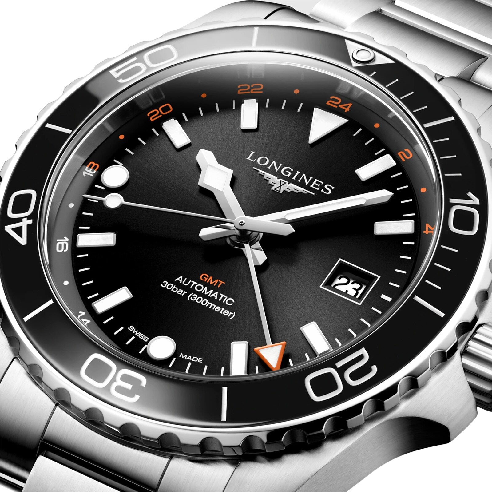 Close-up of a Longines Hydroconquest automatic watch featuring a black dial and bezel, orange GMT hand, date window, stainless steel case, and 300m water resistance.