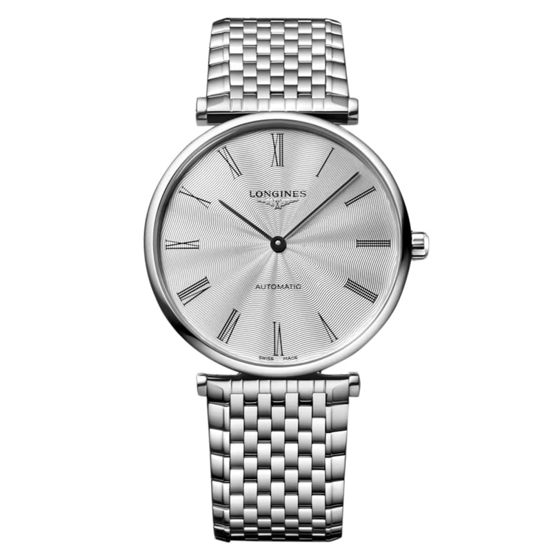 The Longines La Grande Classique de LONGINES wristwatch features a silver round face with Roman numeral markers and a woven metal band, showcasing timeless refinement and classic elegance against a white background.