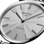Close-up of a silver Longines La Grande Classique de LONGINES wristwatch with a patterned dial, Roman numerals, and black hands, displaying 2:07 in elegant style.