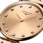 Close-up of the La Grande Classique de LONGINES by Longines, a gold wristwatch with diamond hour markers and two gold hands, showing 10:10.
