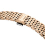 A close-up of a gold metal La Grande Classique de LONGINES watch bracelet with a folding clasp engraved with the Longines logo and winged hourglass symbol.