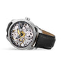 The Tissot T-Complication Squelette Mechanical is a silver skeleton watch with Swiss movement, visible gears, black hour markers, and a black leather strap, displayed angled on a white background.