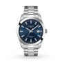 The Tissot Gentleman Powermatic 80 Silicium is a silver wristwatch with a blue dial, silver hour markers, date window at 3 o’clock, and a stainless steel case and bracelet.