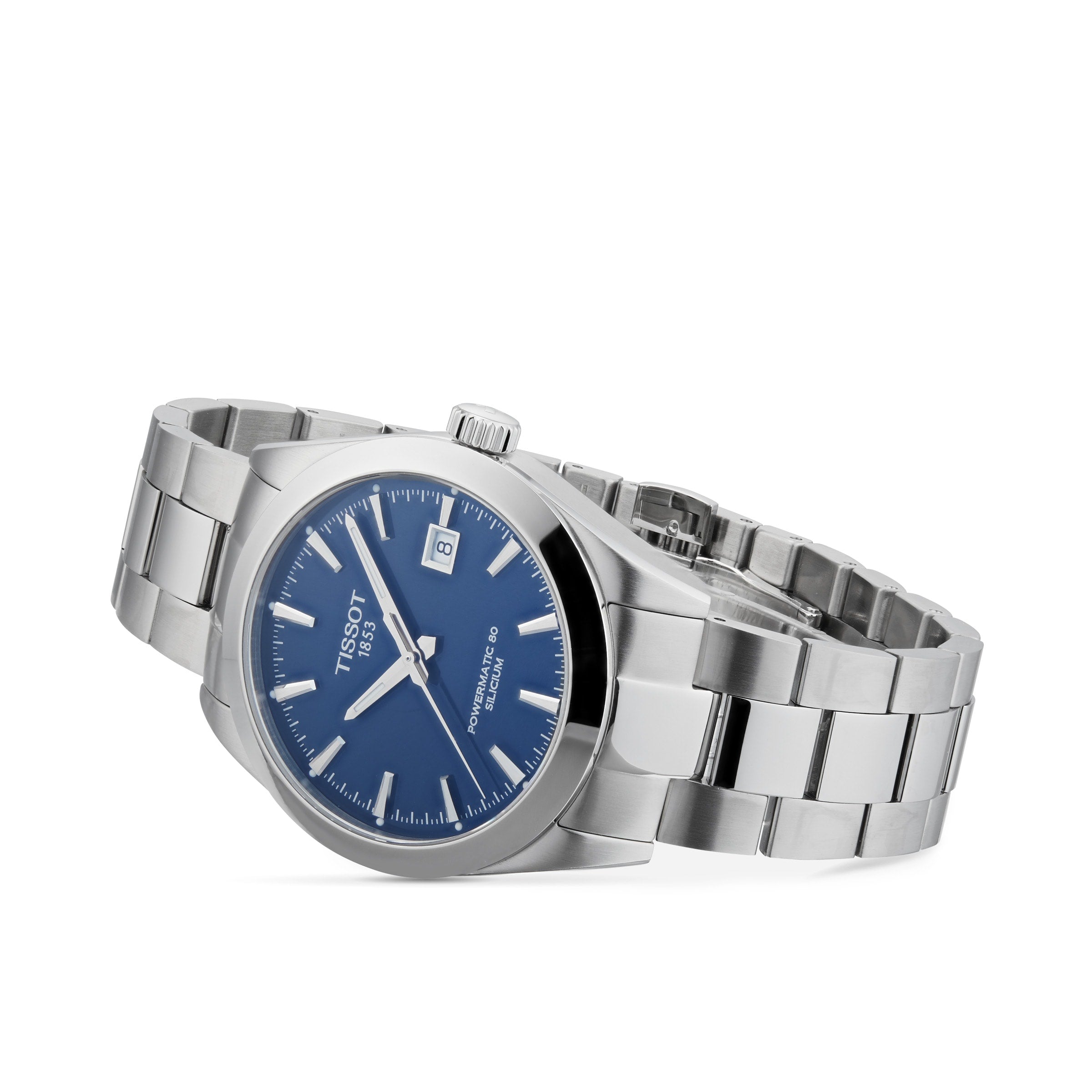 The Tissot Gentleman Powermatic 80 Silicium, a stainless steel watch with blue dial, silver hour markers, and date at 3 o’clock, is shown angled on a white background.
