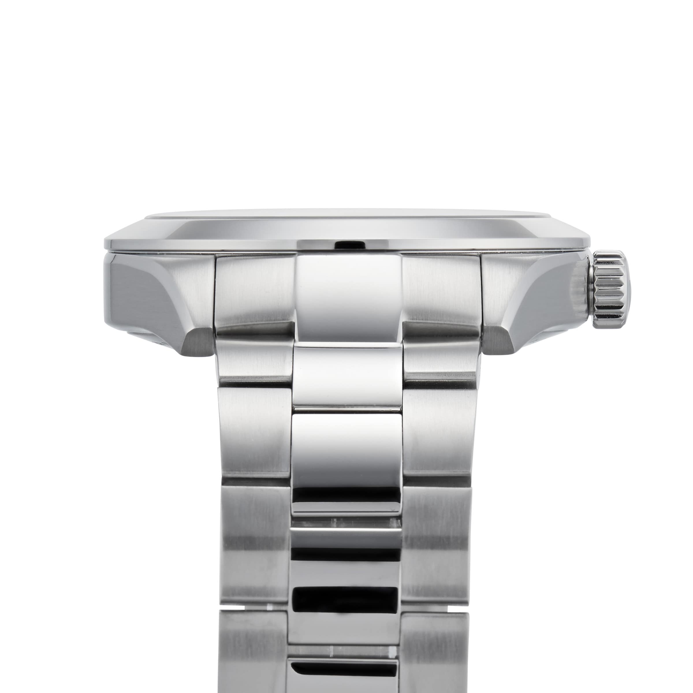 Close-up side view of the Tissot Gentleman Powermatic 80 Silicium, showcasing a stainless steel case with a linked bracelet band and the crown positioned on the right.