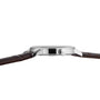 Side view of the Tissot Classic Dream, featuring a silver case and brown leather strap with visible crown and slim profile against a white background—highlighting Tissot’s refined craftsmanship.