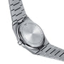 Back view of the Tissot PRX wristwatch with a stainless steel bracelet. The case back shows brand and model details, water resistance info, and material specs, highlighting its 1970s-inspired design and precise Swiss quartz movement.
