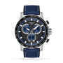 The Tissot Supersport Chrono features a black dial with blue subdials, tachymeter bezel, blue textured strap, and precise Swiss quartz movement, displaying 1:53:12.