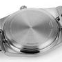 Close-up of the Tissot PRXs stainless steel case back, featuring engraved model details, water resistance info, and Swiss quartz movement specs.