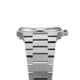 Side view of the Tissot PRX, a silver metal wristwatch featuring a thick linked bracelet and visible crown.