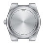 Back view of a Tissot PRX watch case displays engraved brand name, Swiss quartz movement, stainless steel, sapphire crystal, model number, and water resistance up to 10 bar.