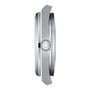 Side view of a silver Tissot PRX watch case showing the crown with T-shaped logo and Swiss quartz movement, set against a plain white background.