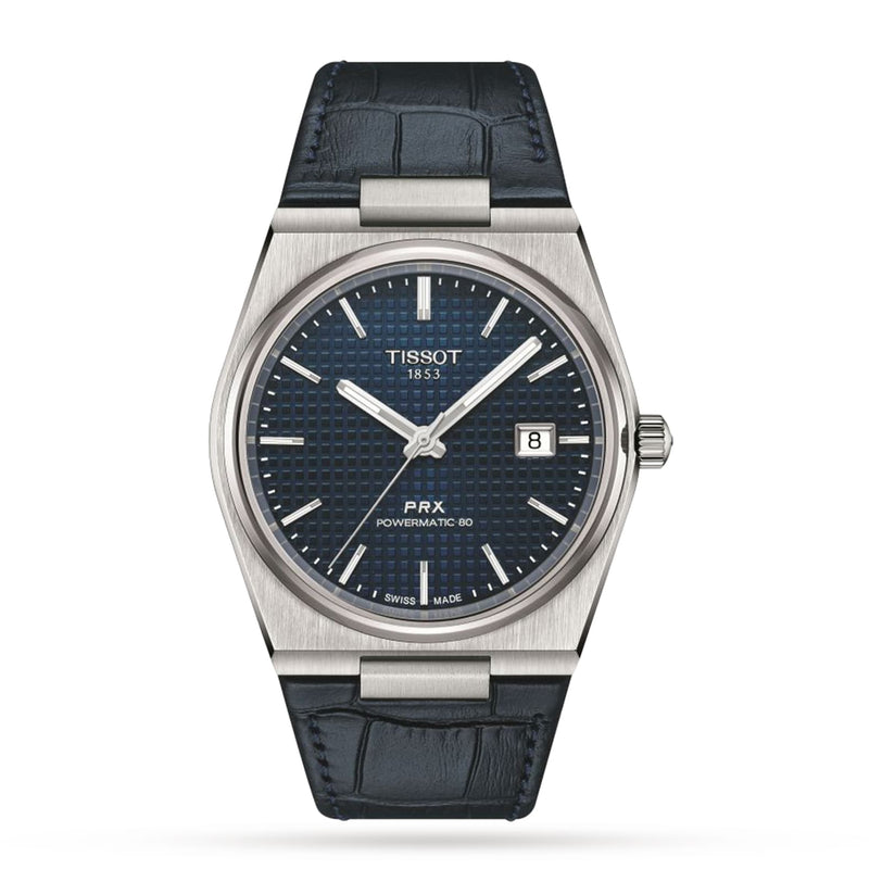 The Tissot PRX Powermatic 80 features a stainless steel case, black leather strap, blue textured dial, date window at 3 oclock, and silver hour markers on a white background.