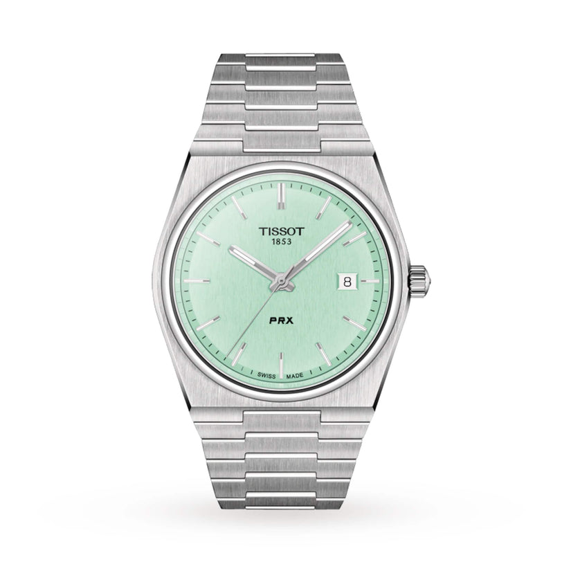 A stainless steel Tissot PRX wristwatch features a mint green dial, silver hour markers, date display at 3 o’clock, and “Tissot 1853” on the face, showcasing classic design.