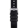 Close-up of a black rubber strap with a silver buckle engraved Tissot, designed for the Seastar 1000 divers watch and built to be 30 bar water resistant.