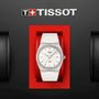 The Tissot PRX 40mm watch with a white textured band and silver dial is displayed in a red case below the Tissot logo on a black background.