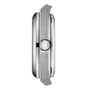 Side view of the silver Tissot PRX Powermatic 80 case featuring a brushed metal finish, logo-engraved crown, and raised bezel, accentuating the green dials elegance against a white background.
