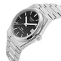 The Tissot PRX Powermatic 80 is a stainless steel 35mm watch with a black waffle dial, silver hour markers, date display, and a sleek metal bracelet.