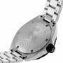 Close-up of the back of a TAG Heuer Formula 1 Date stainless steel wristwatch, featuring engraved text and a metal bracelet.