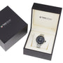 A TAG Heuer Formula 1 Date watch is shown with a black dial and stainless steel case, displayed in an open branded box beside its closed outer packaging.