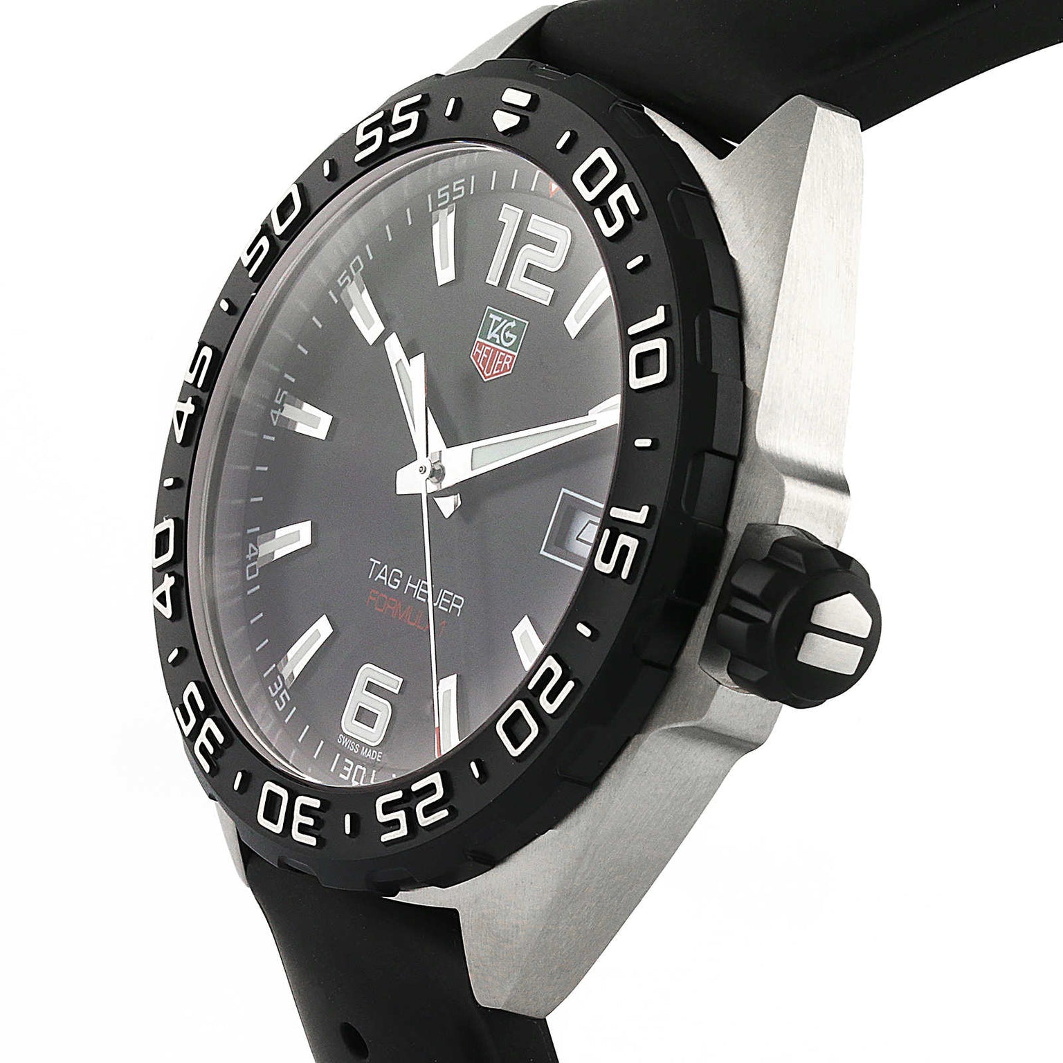 The TAG Heuer Formula 1 Date wristwatch features a black dial with silver hour markers, a date display, black bezel, black rubber strap, and precise quartz movement.