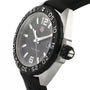 The TAG Heuer Formula 1 Date wristwatch features a black dial with silver hour markers, a date display, black bezel, black rubber strap, and precise quartz movement.