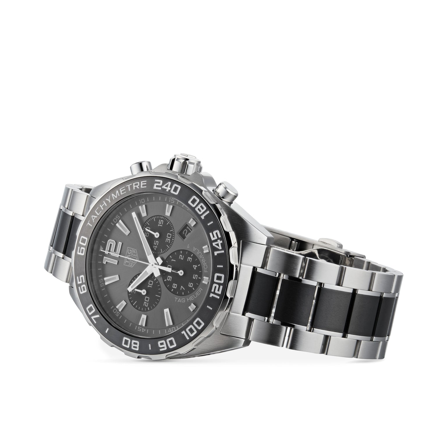The TAG Heuer Formula 1 Chronograph features a stainless steel case, black dial with silver markers, and black accents on the bracelet, reflecting a motor-racing inspired design. Photographed on a white background.