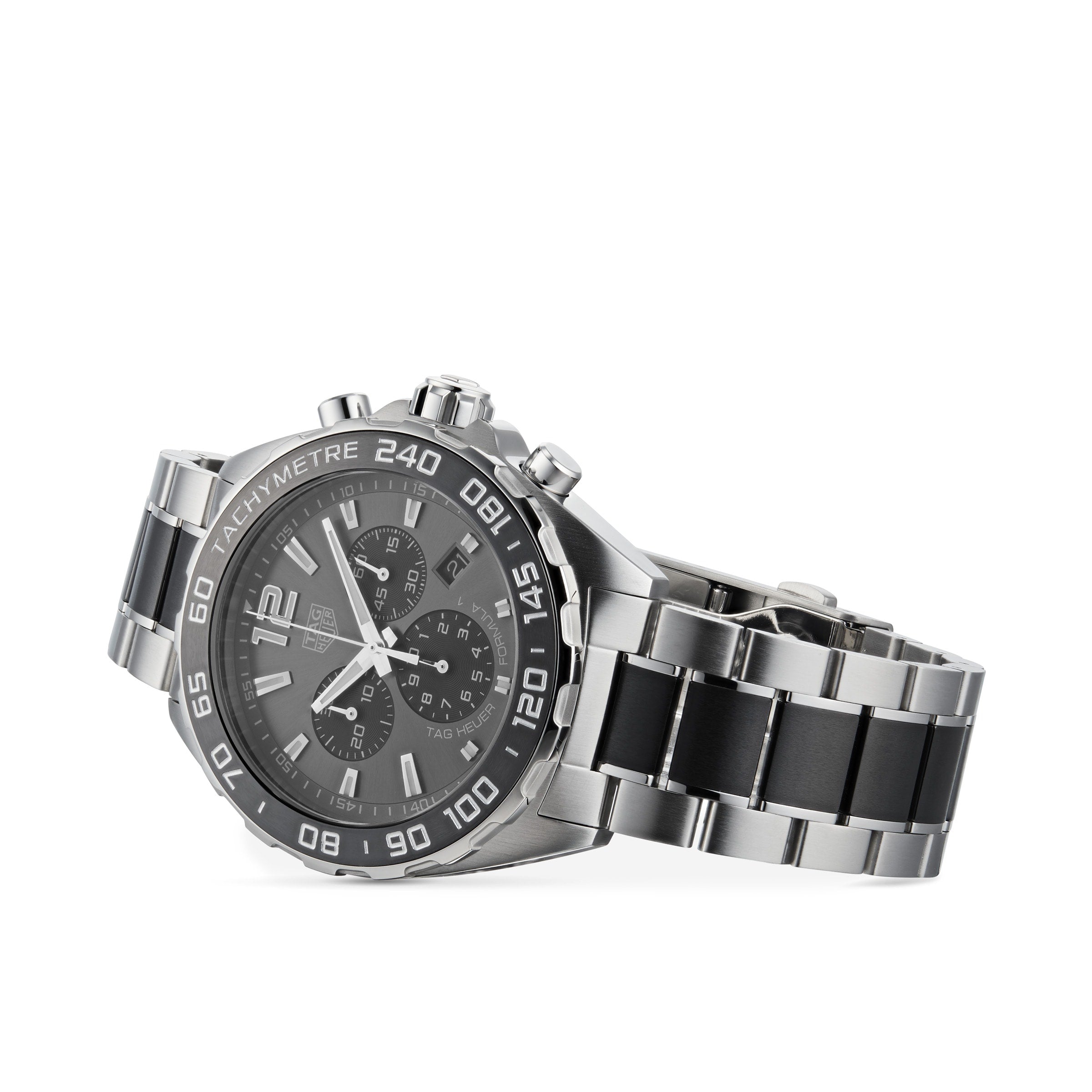 The TAG Heuer Formula 1 Chronograph features a stainless steel case, black dial with silver markers, and black accents on the bracelet, reflecting a motor-racing inspired design. Photographed on a white background.