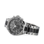The TAG Heuer Formula 1 Chronograph features a stainless steel case, black dial with silver markers, and black accents on the bracelet, reflecting a motor-racing inspired design. Photographed on a white background.
