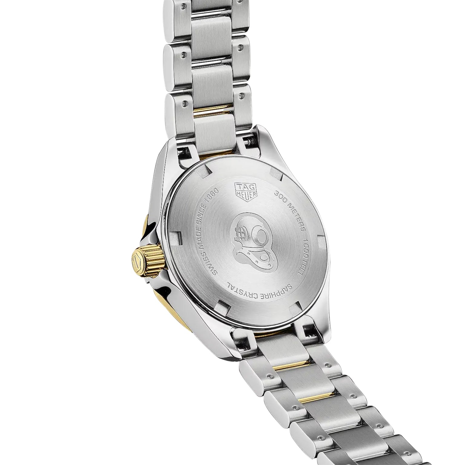 The back of a TAG Heuer Aquaracer Date watch features a stainless steel and two-tone bracelet, engraved with 200-meter water resistance and an image of a helmet.